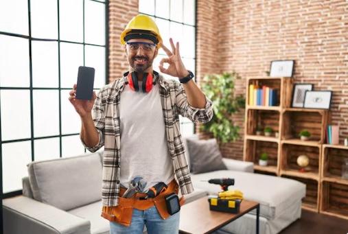 Local Handyman in Florida – Home Repair & Maintenance Expert Smiling handyman wearing blue overalls and red cap holding a wrench against yellow background — professional local handyman offering repair and maintenance services in Florida, Tampa, Clearwater, Largo, Kenneth City, St/ Pettersburg